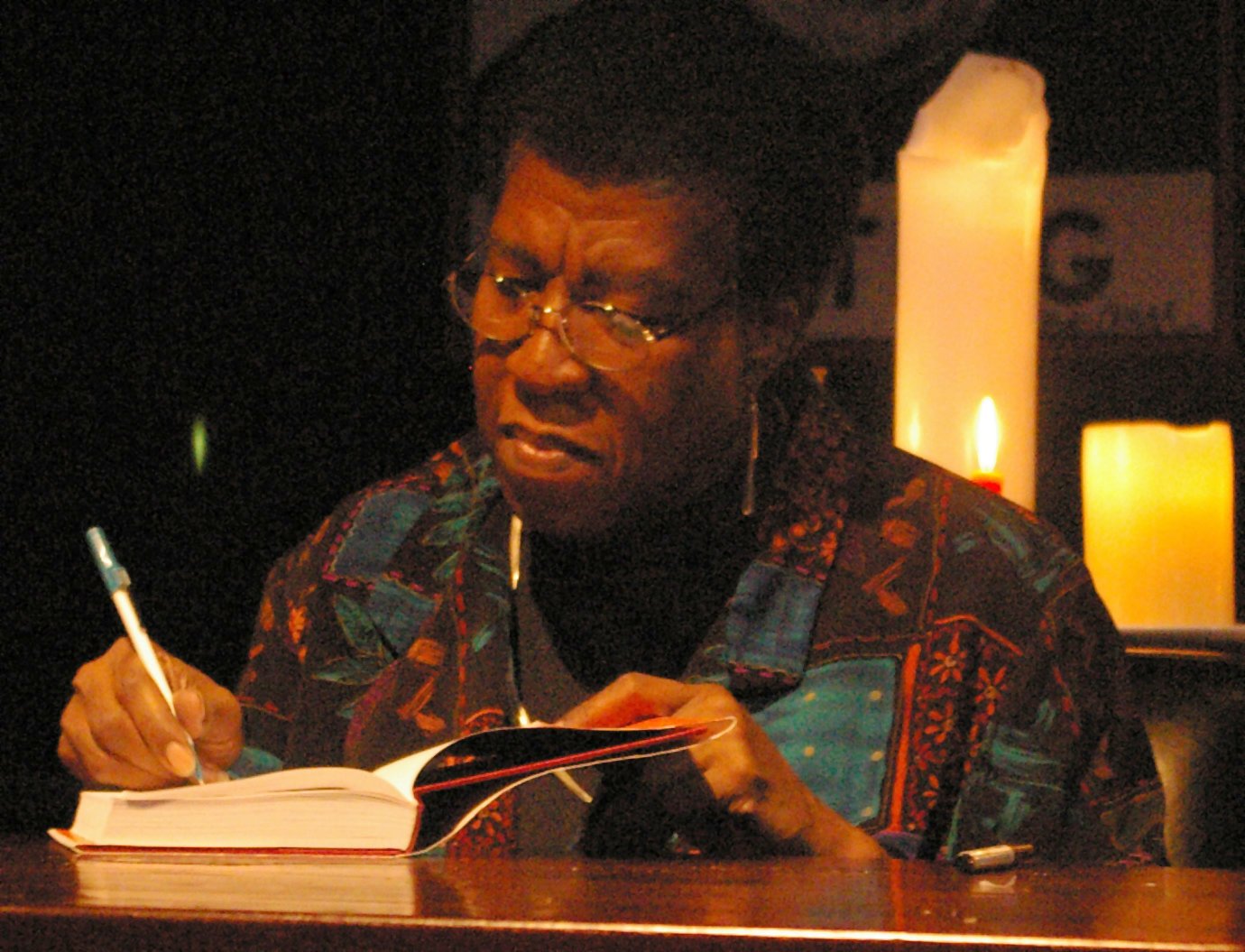 Octavia Butler herself, signing a hardcover copy of a book