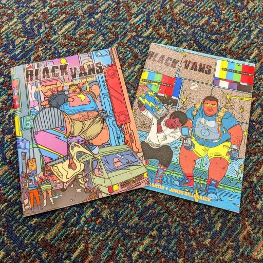 There are two comic books laying on a multicolored confetti rug--Black Vans issue 1&2. The covers depict Bo, a chubby Black superhero''s helper in techie combat gear, in various action poses.